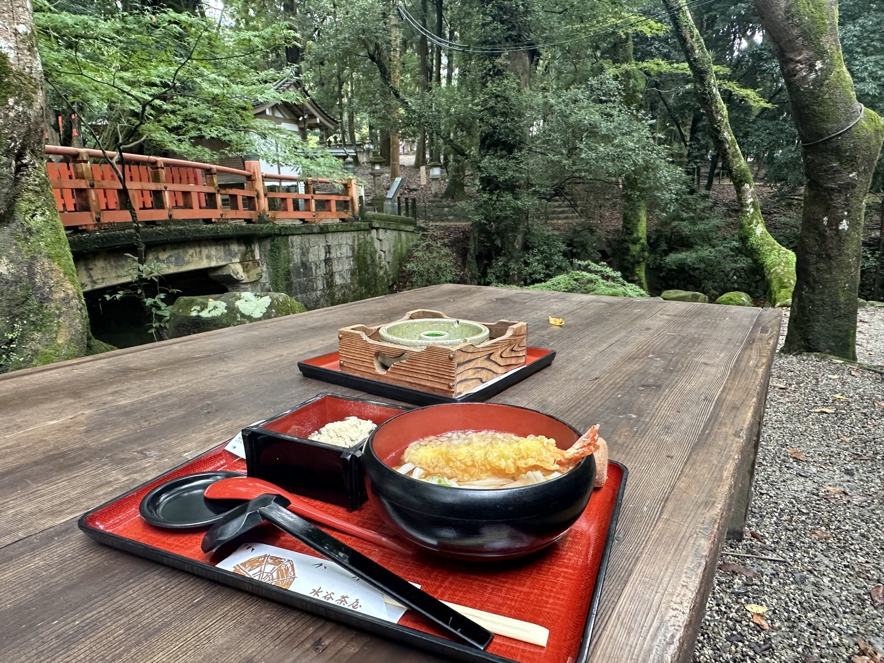 Udon on a wooden table in the forest